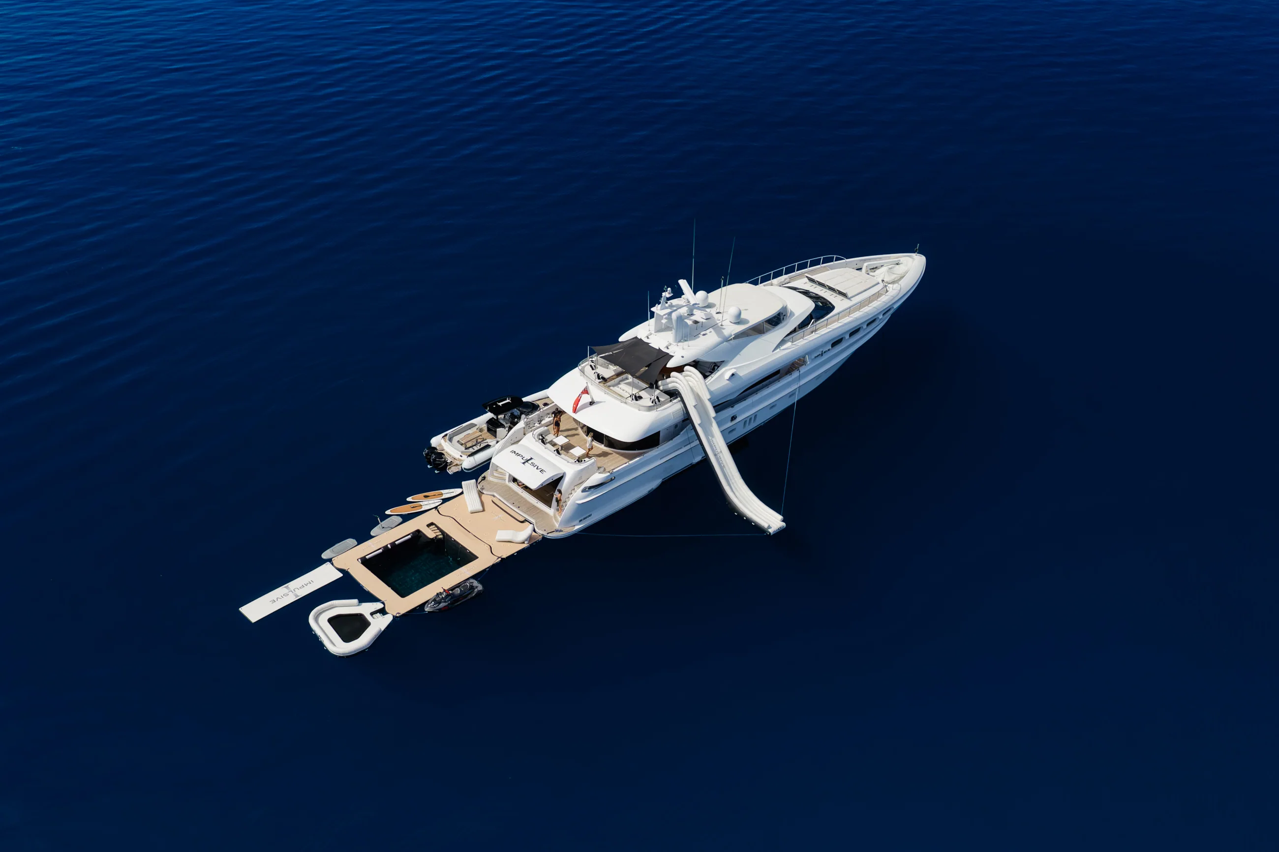 M/Y Impulsive at anchor inside a Fijian reef, aerial view