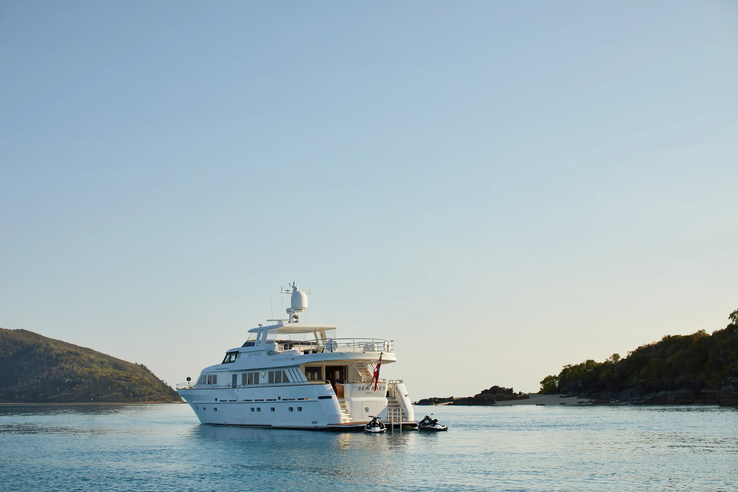 M/Y Sea Raes, at anchor, jet skis at her stern