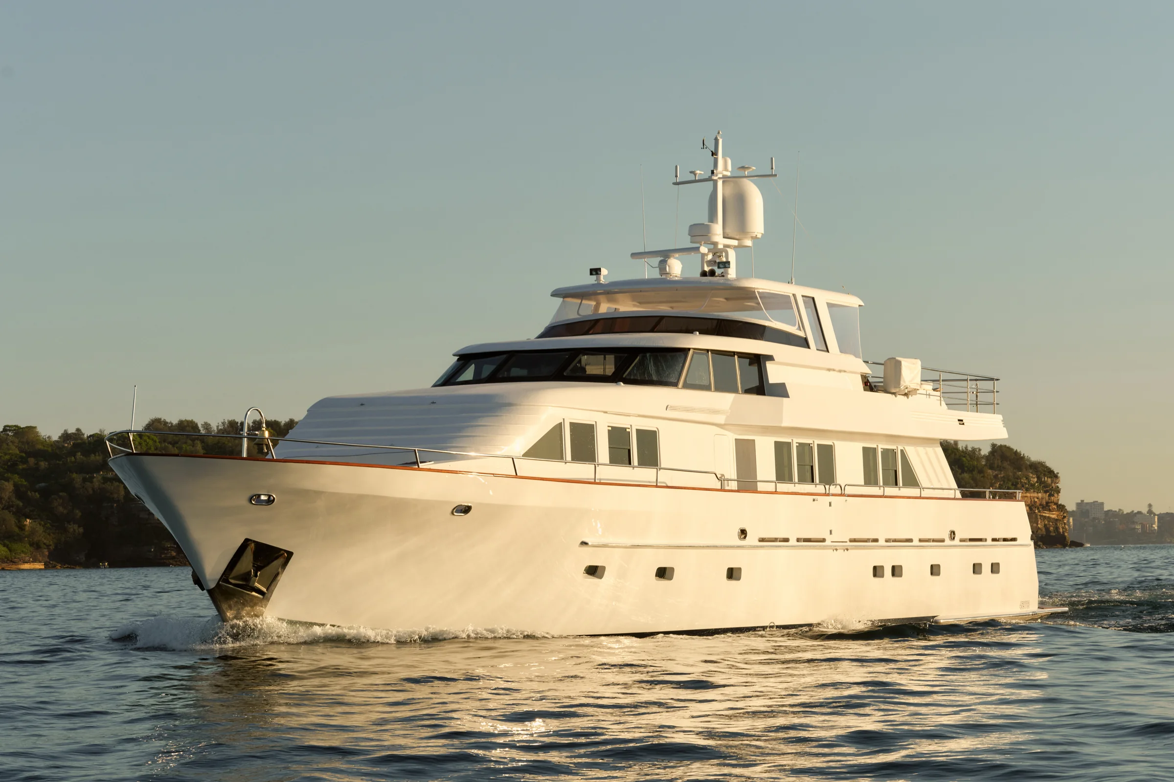 M/Y Sea Raes under way on Sydney Harbour in golden light
