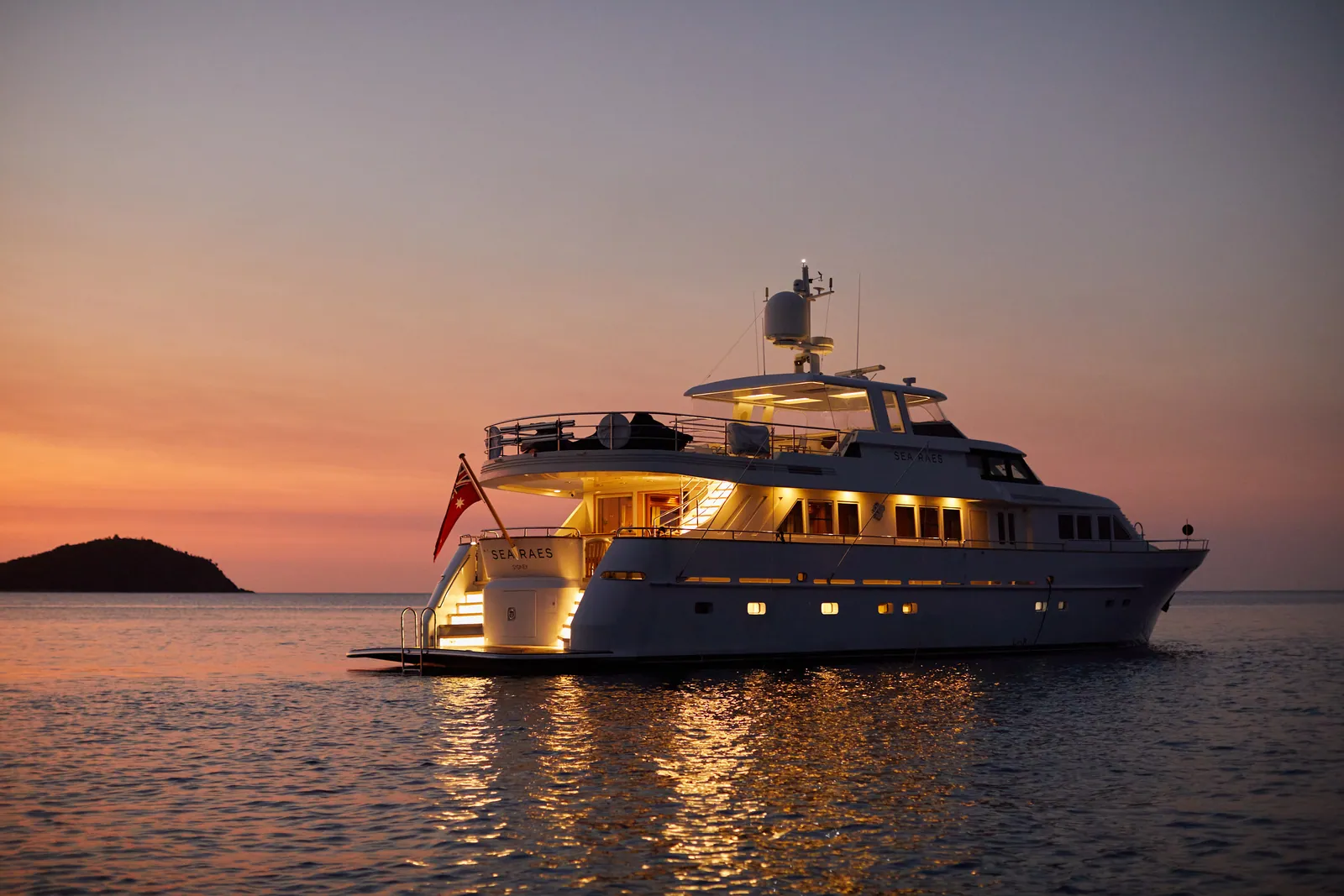 M/Y Sea Raes, lit at dusk