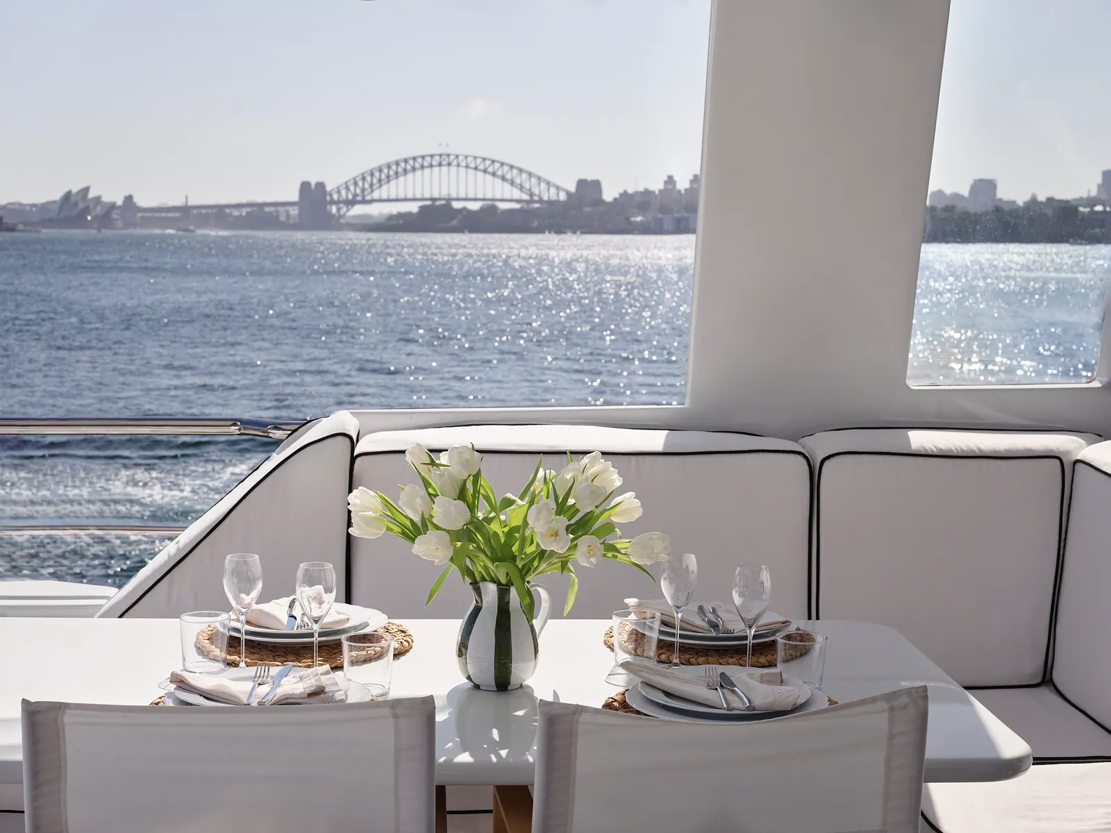 M/Y Sea Raes, the table set on the upper deck, the Harbour Bridge behind